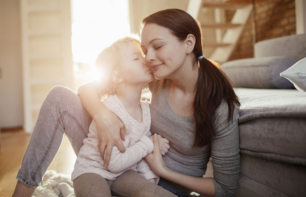 Mother and daughter hugging